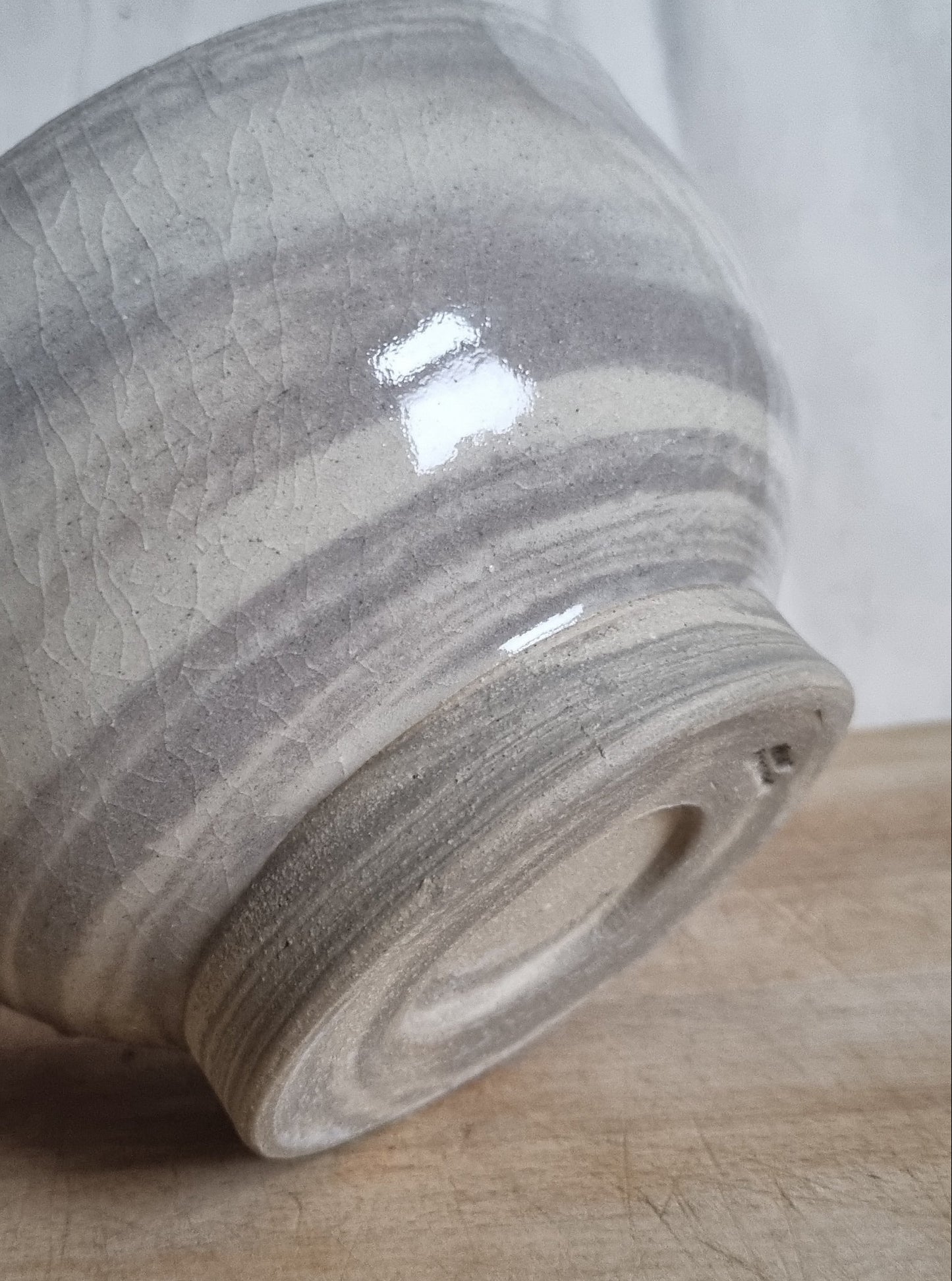Textured ceramic jar on a wooden surface